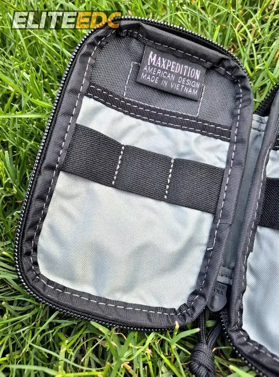 Maxpedition Micro open empty, left half with flap pockets