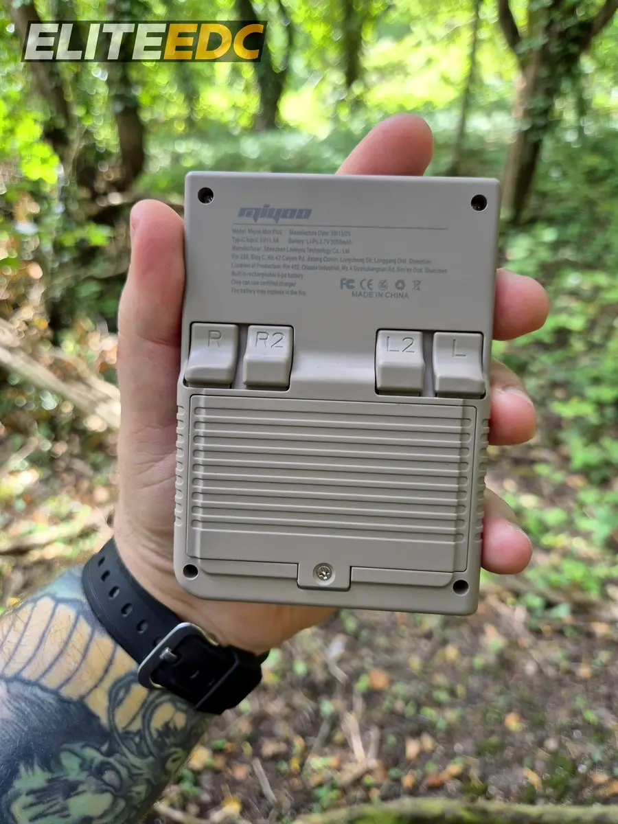 Miyoo Mini Plus back in hand, shoulder buttons visible
