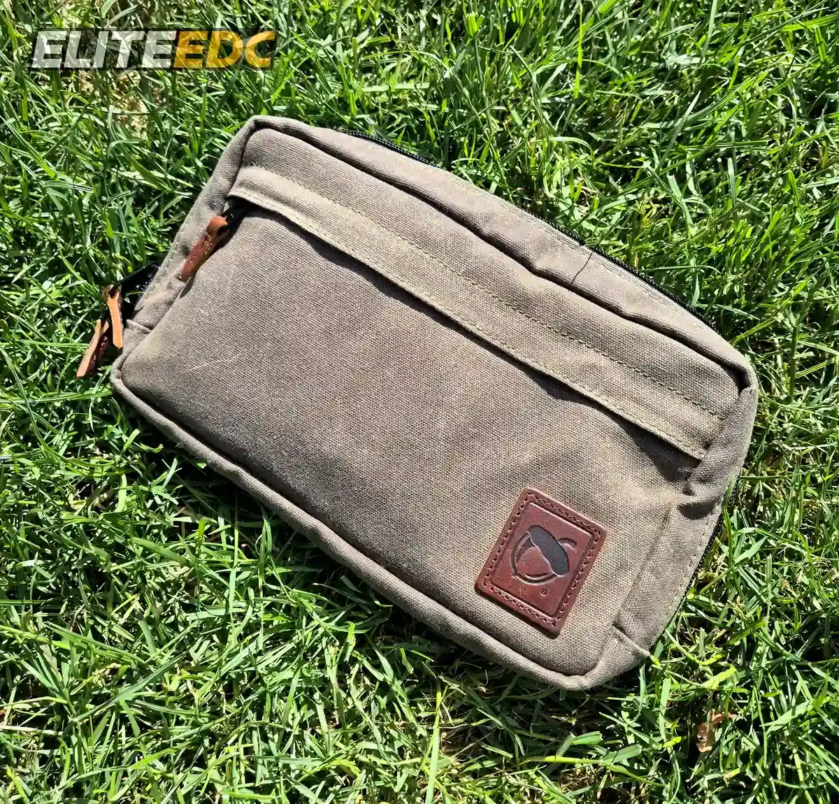 NutSac Speed Sling front, full-grain leather logo patch detail