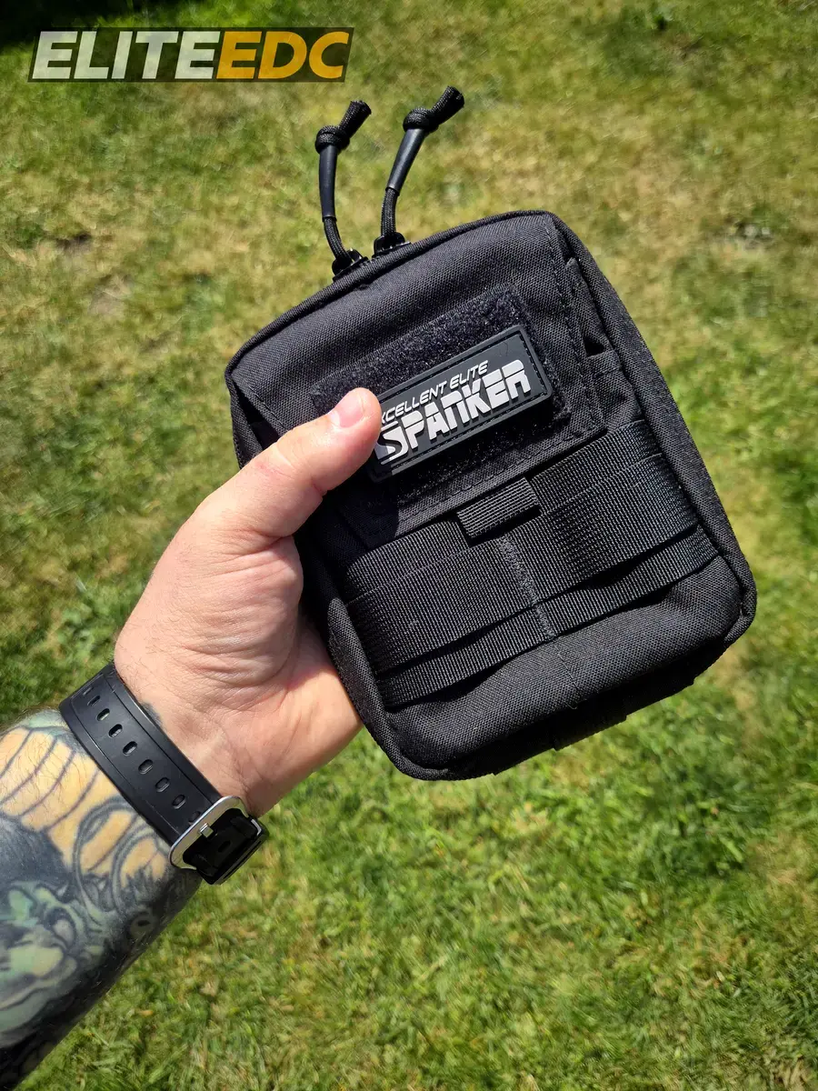 Excellent Elite Spanker MOLLE admin pouch held in hand showing size